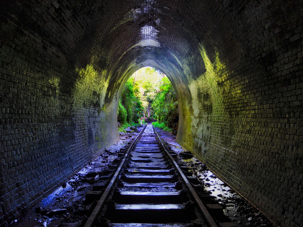 View of abandoned rail tracks in Glow Worm Tunnel of New South Wales, Australia