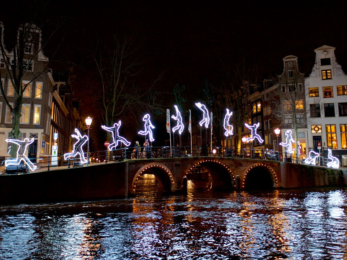 Bridge over canal in Amsterdam, decorated with holiday lights