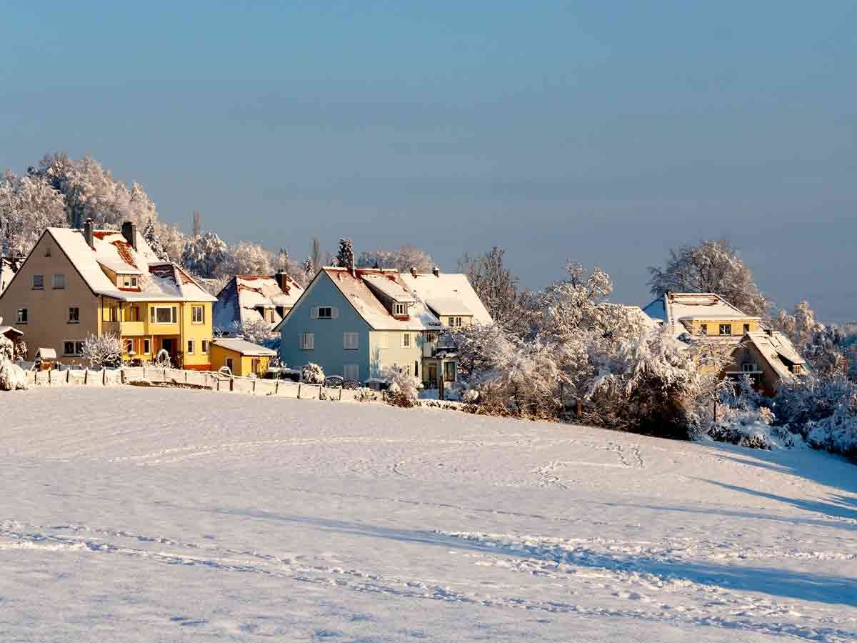 Snow-covered homes on hillside in Germany