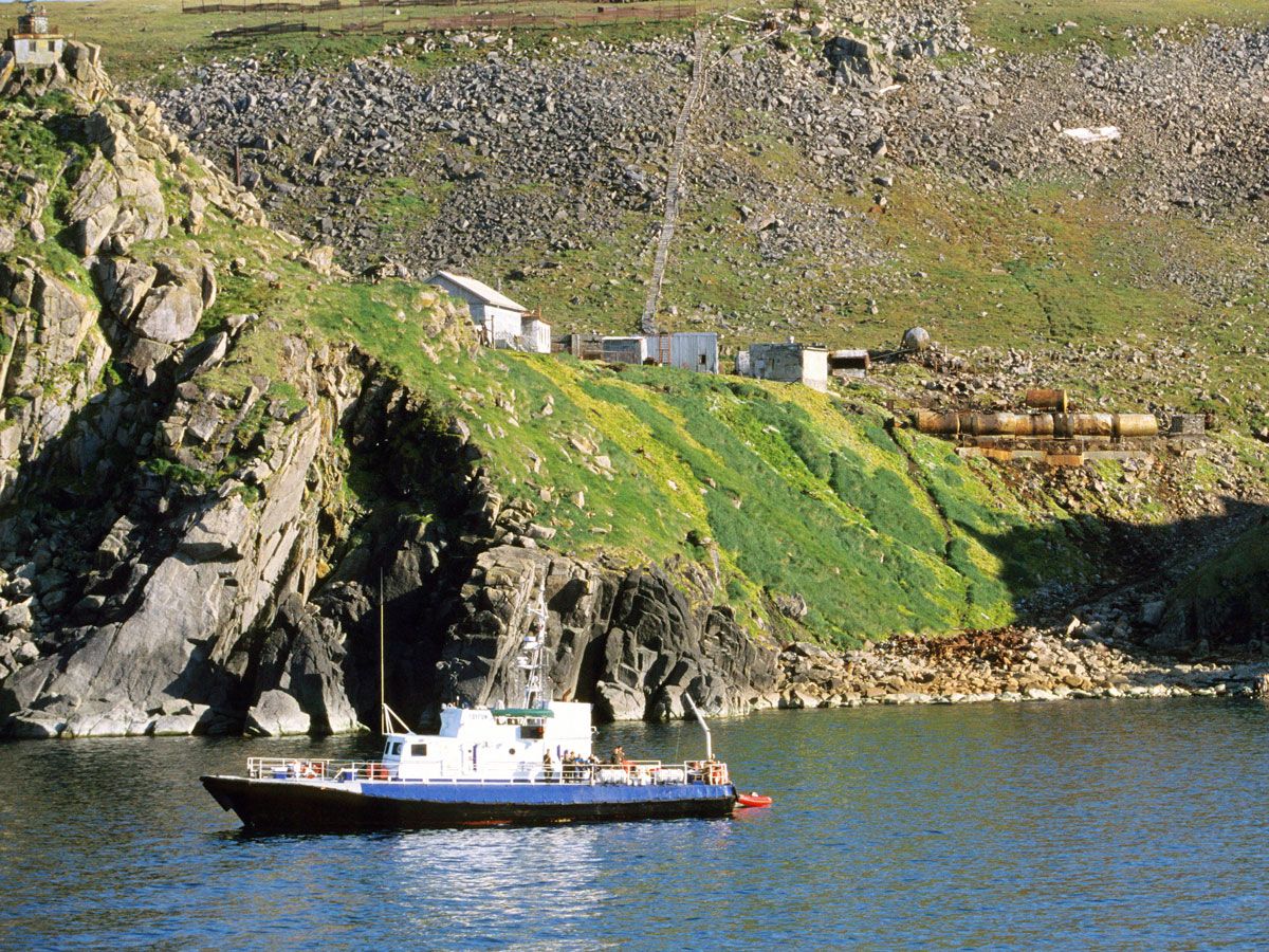 Ship off the rocky coast of the Diomede Islands