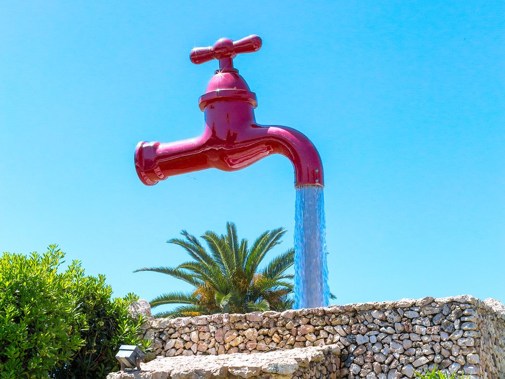Magic Tap fountain in Santa Galdana, Spain, seemingly suspended in mid-air