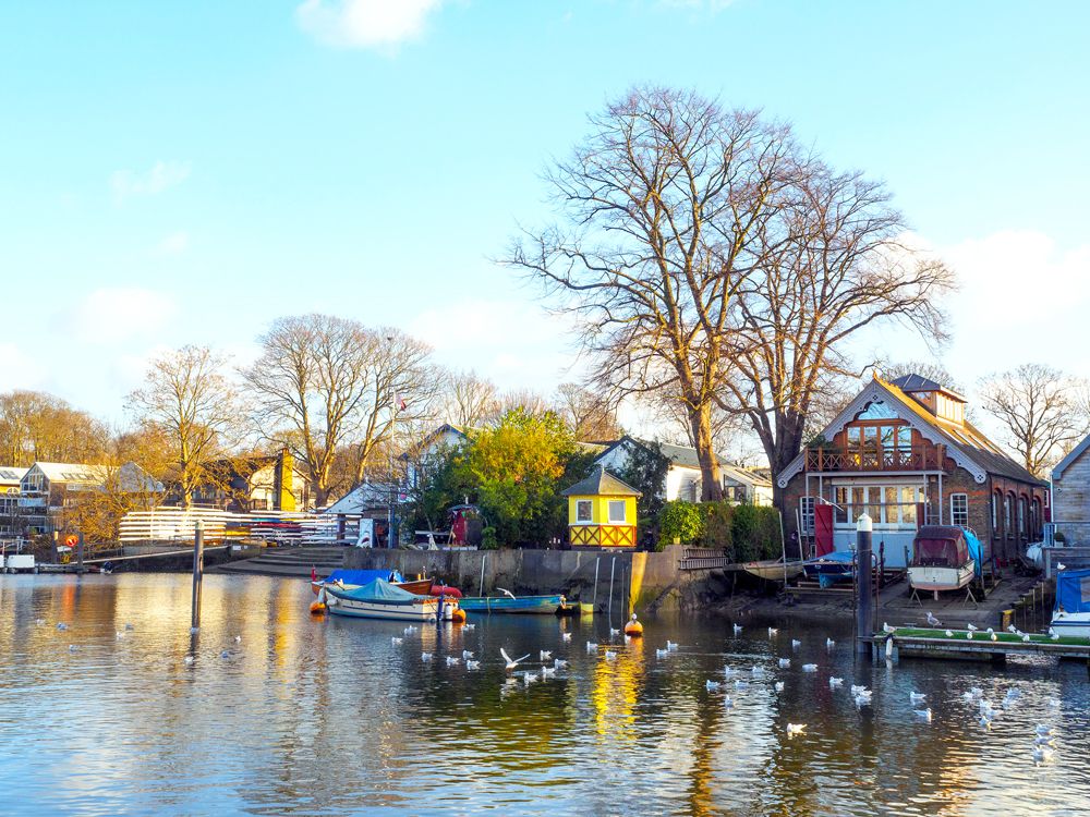 Waterfront homes and boats on Eel Pie Island in London, England
