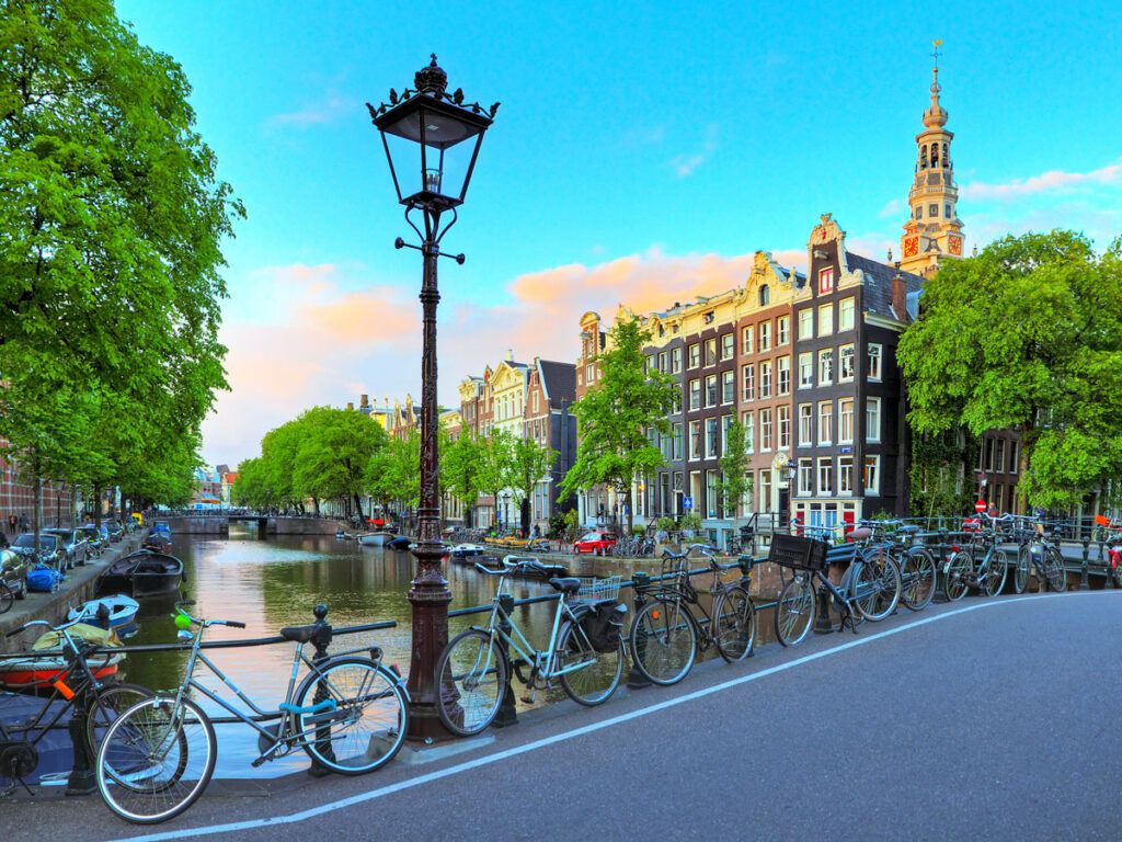 Bikes locked to bridge over canal in Amsterdam