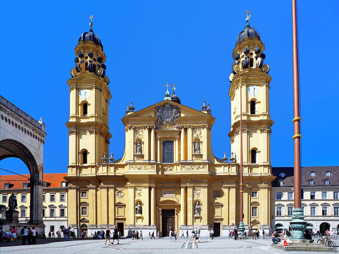 People walking in front of Theatine Church in Munich, Germany
