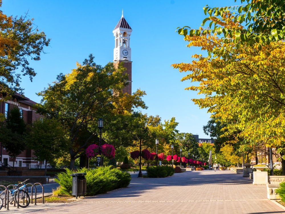 Purdue Bell Tower partially obscured by trees on campus of Purdue University