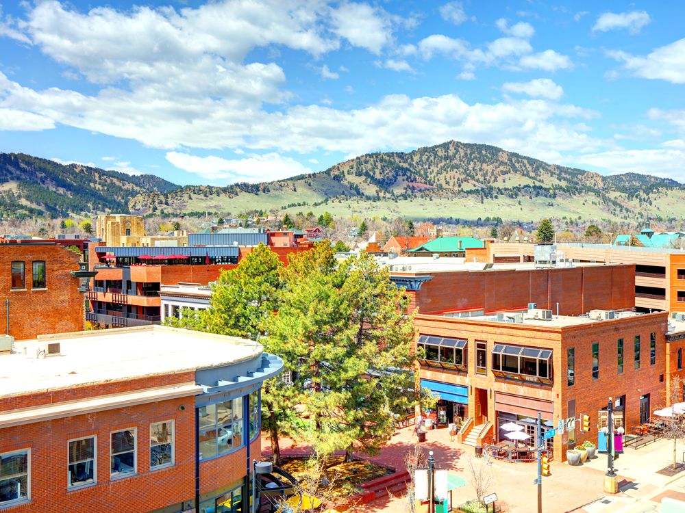 Downtown Boulder, Colorado, with mountains in background