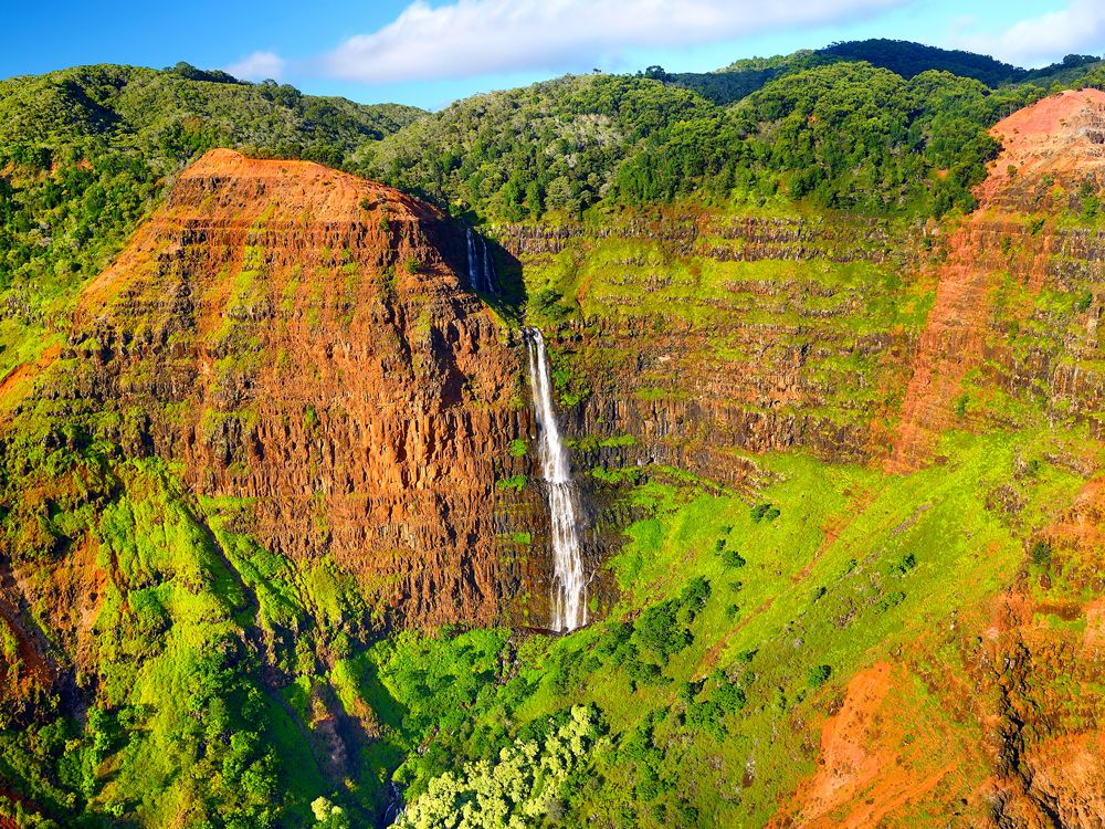 Waterfall falling over the walls of Waimea Canyon, Hawaii
