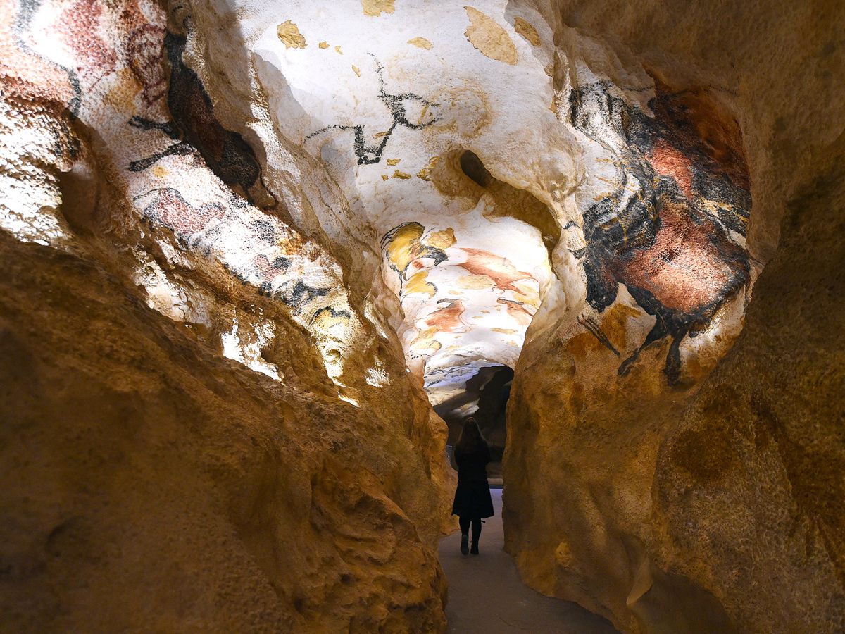 Visitor inside replica of Lascaux Cave in France