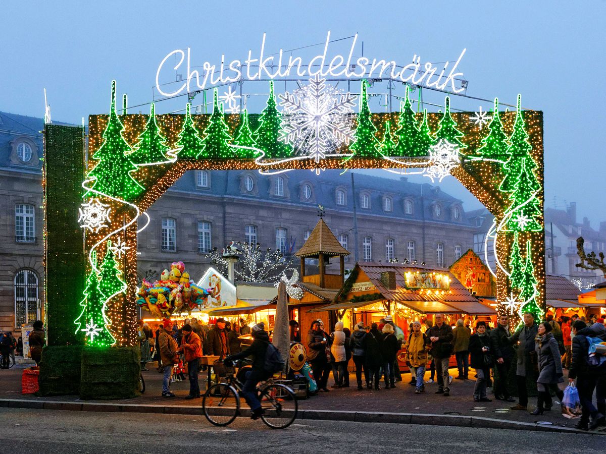 Sign decorated with holiday lights for Christkindelsmärik in Strasbourg, France