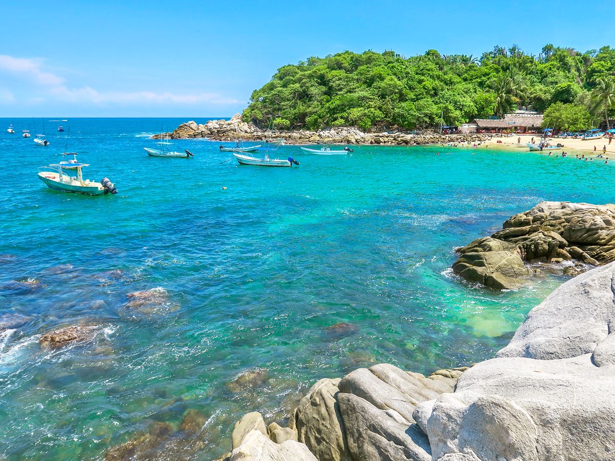Boats in bay off coast of Puerto Escondido, Mexico