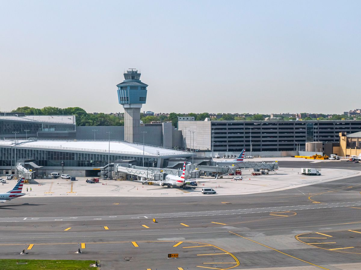 Overview of control tower and planes on tarmac at New York's LaGuardia Airport