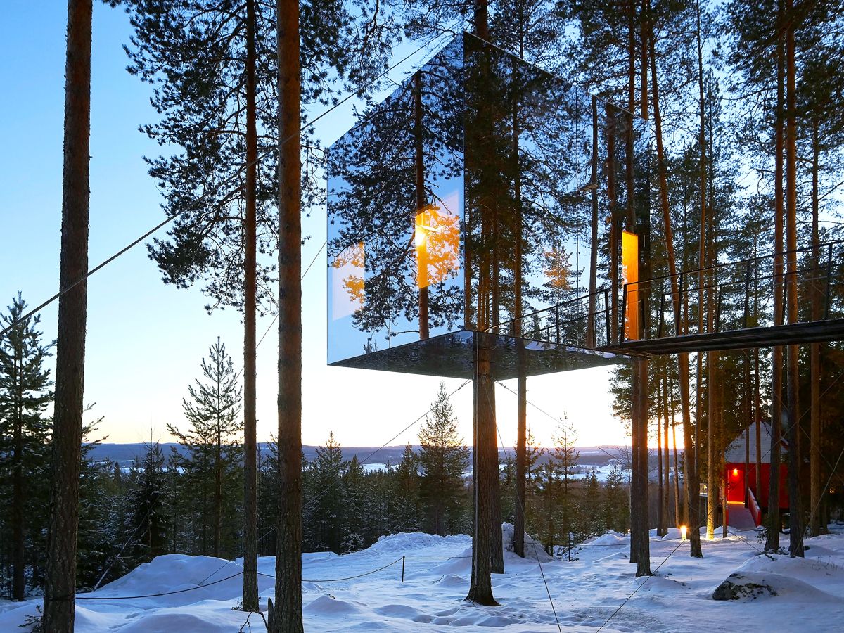 Mirrorcube reflecting snowy landscape of Sweden