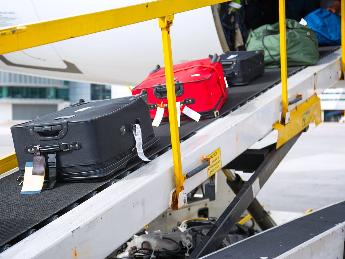 Luggage being loaded into cargo hold of aircraft