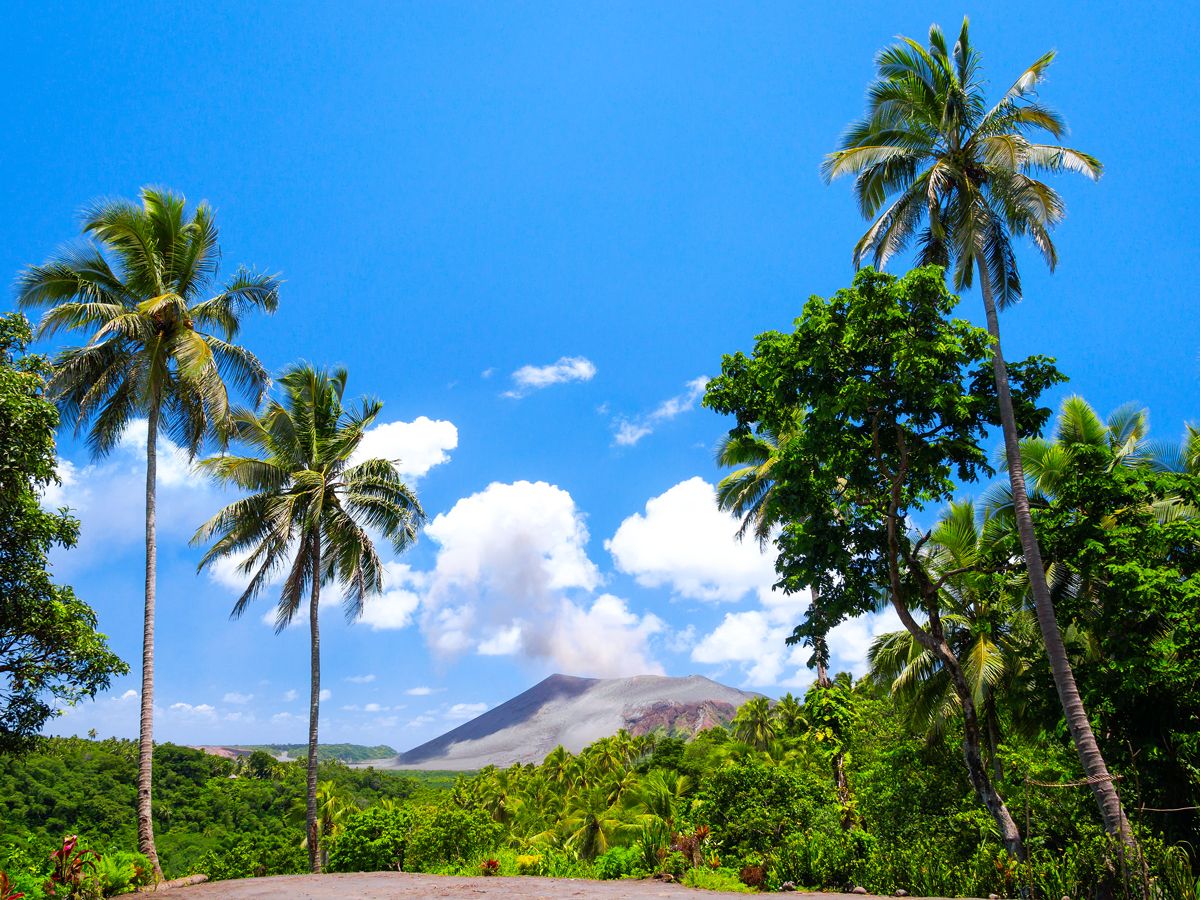 Volcano framed by palm trees in Vanuatu