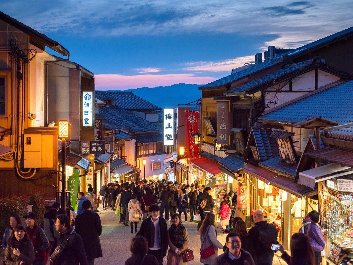Crowded streets of Kyoto's old city, seen at night
