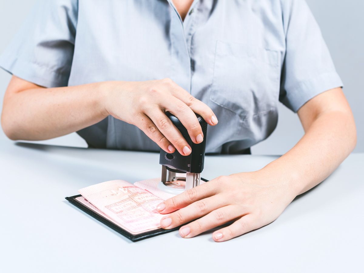 Officer stamping passport