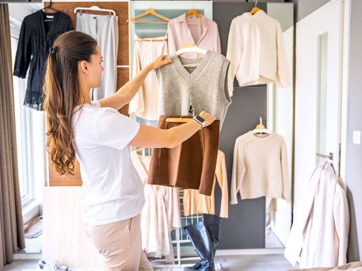 Woman arranging outfits