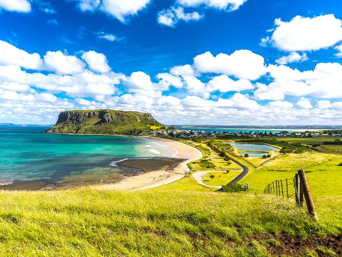 Grassy hills overlooking coastline of Tasmania, Australia