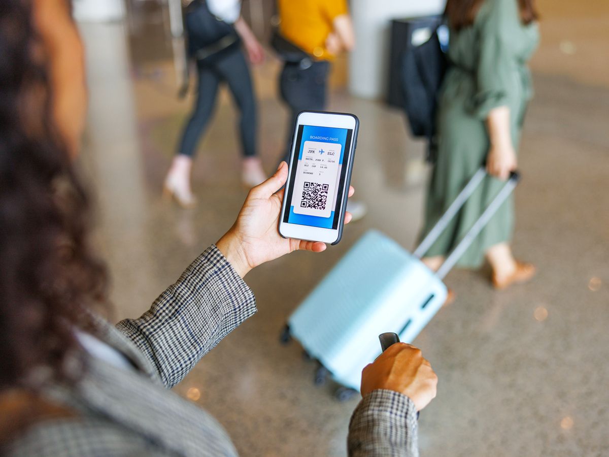 Traveler looking at digital boarding pass on phone