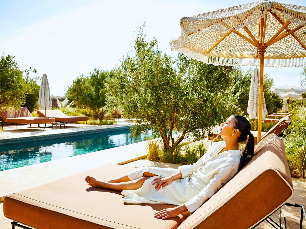 Resort guest lounging poolside