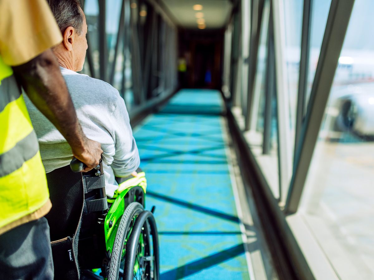 Passenger boarding aircraft using wheelchair