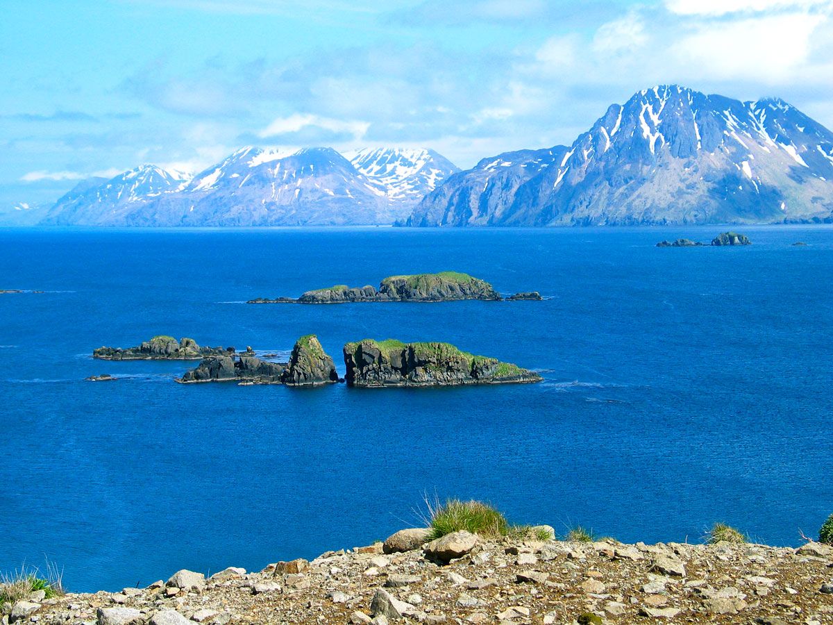 Rocky islets and snow-capped mountains on the Bering Sea