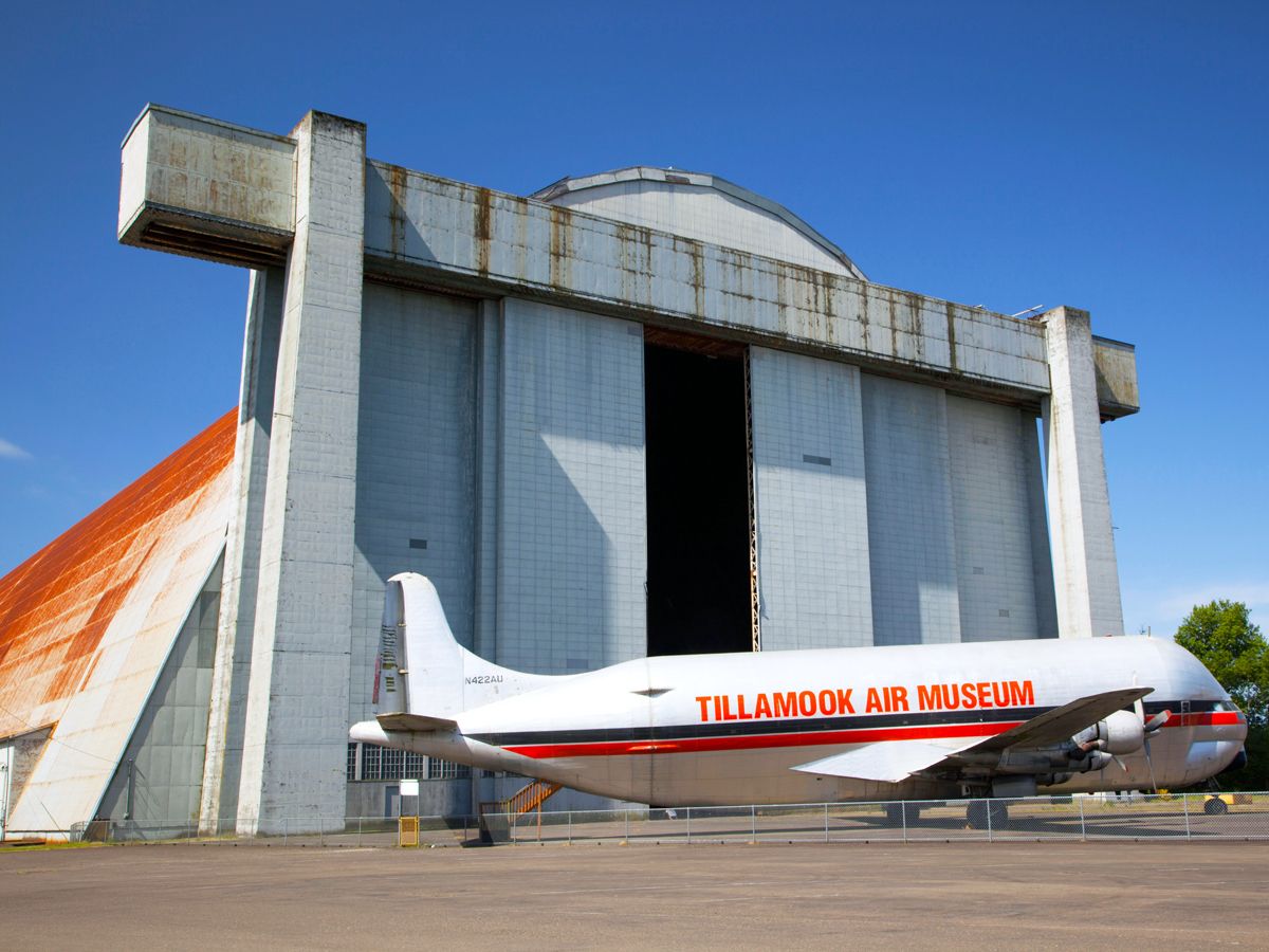 Vintage aircraft parked outside of Tillamook Air Museum hangar in Oregon