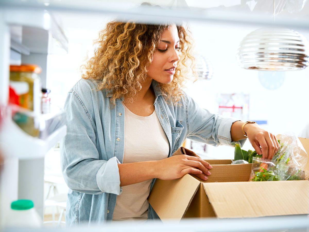 Woman unpacking grocery delivery