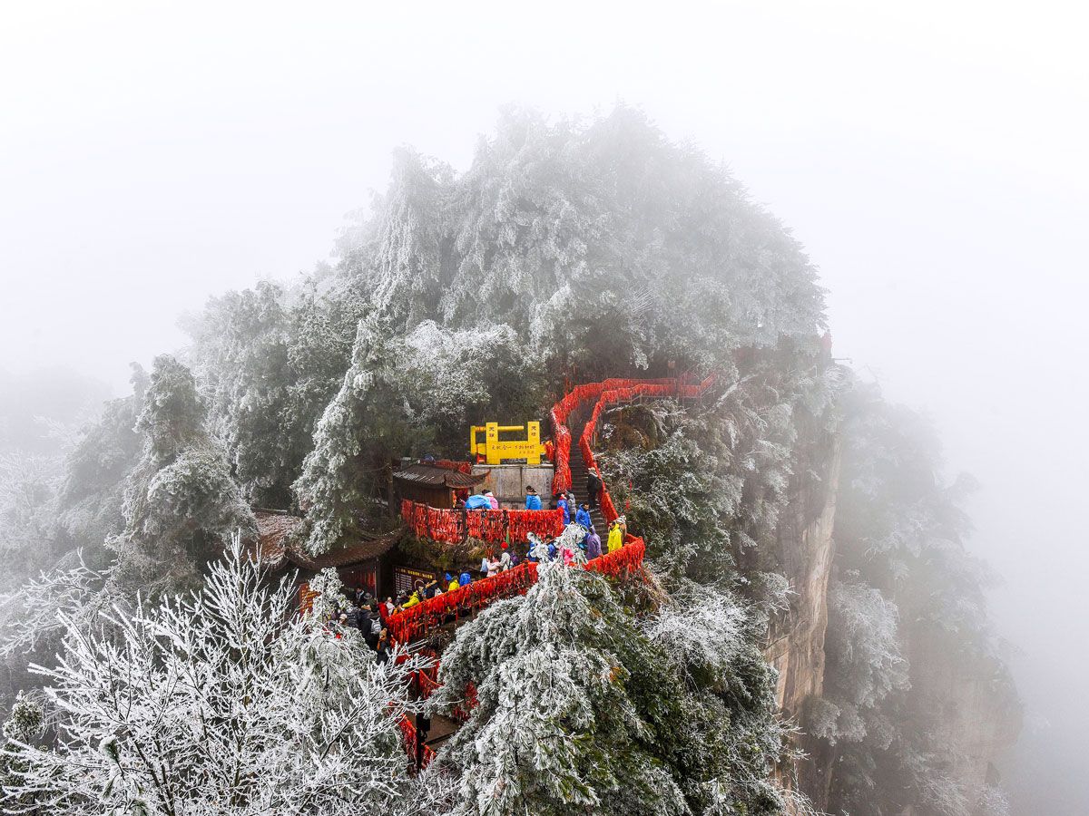 People visiting Xianren Bridge in China in winter