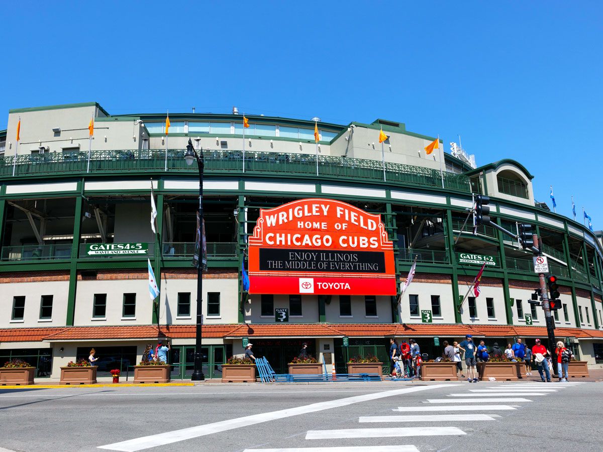 Sign with the words "Wrigley Field, Home of the Chicago Cubs" outside of Wrigley Field