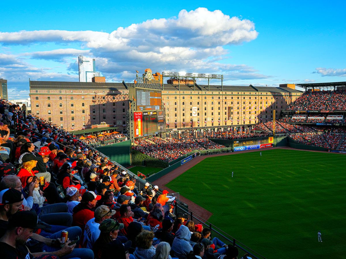 Fans watching game at sunset at Oriole Park in Baltimore, Maryland