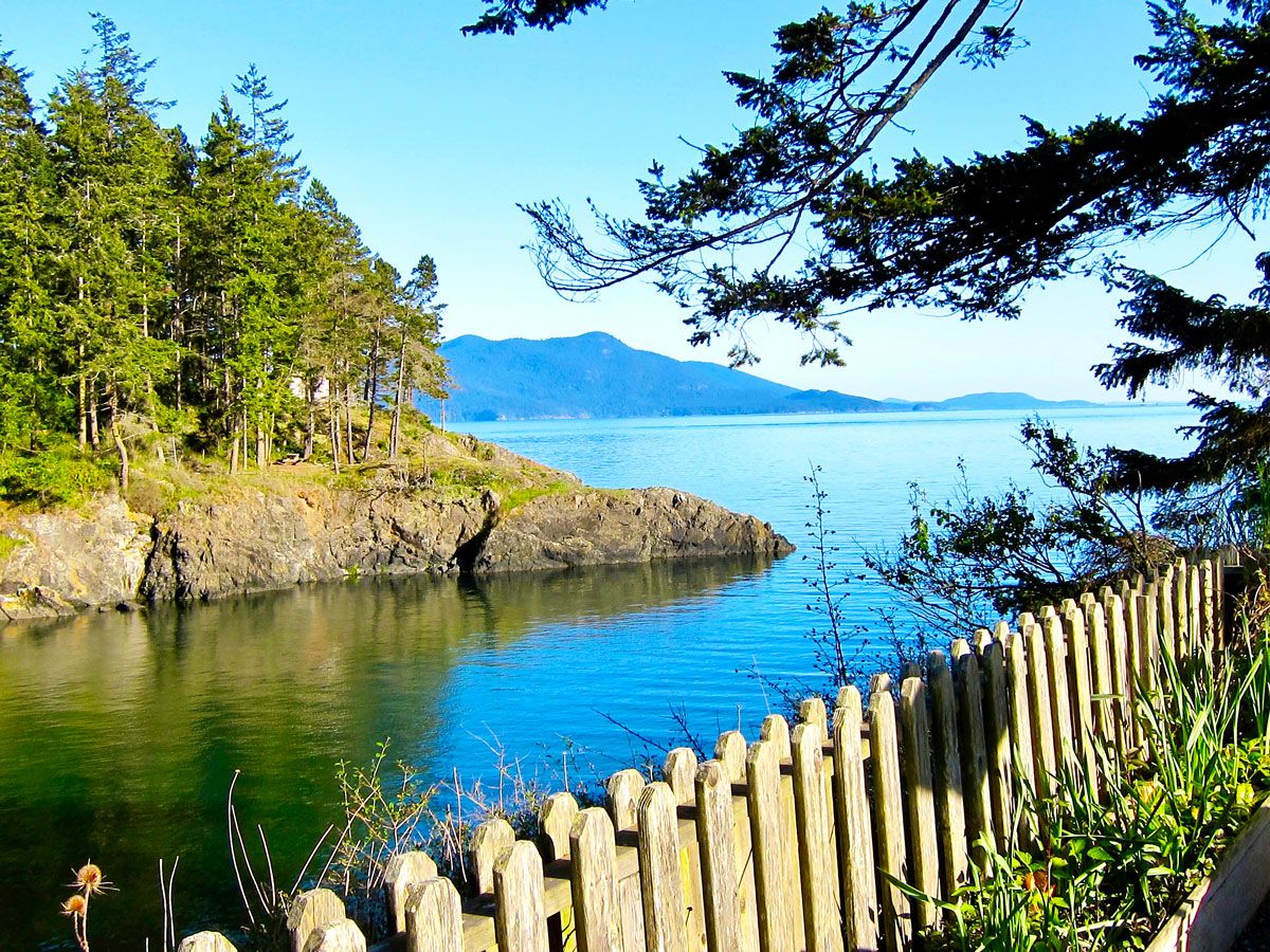 Wooden fence along cove on Orcas Island, Washington