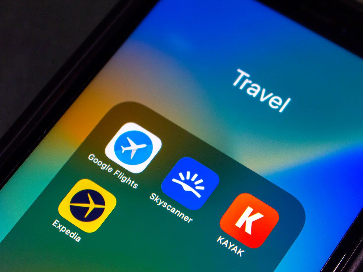 Close-up view of travel apps on cellphone