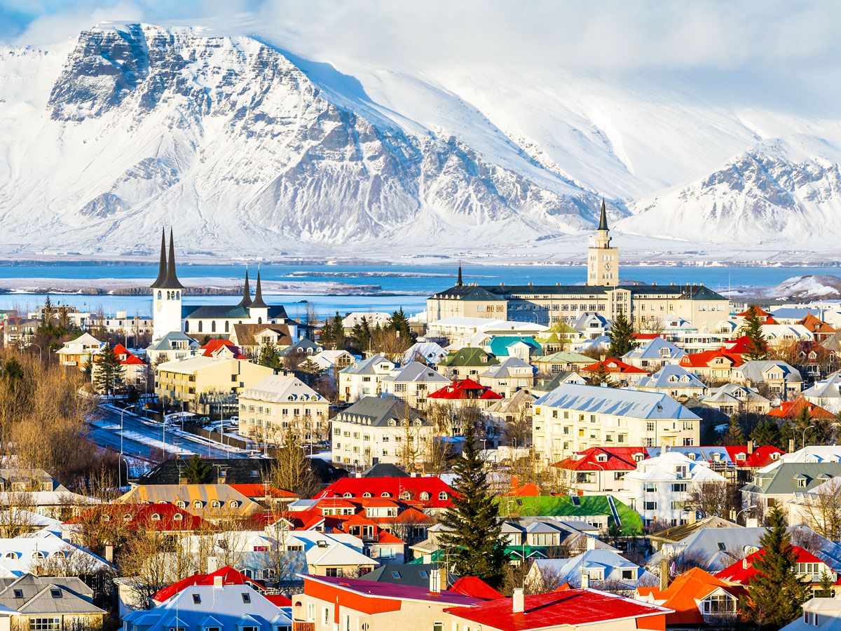 Aerial view of Reykjavik, Iceland, with snow-covered mountains in background