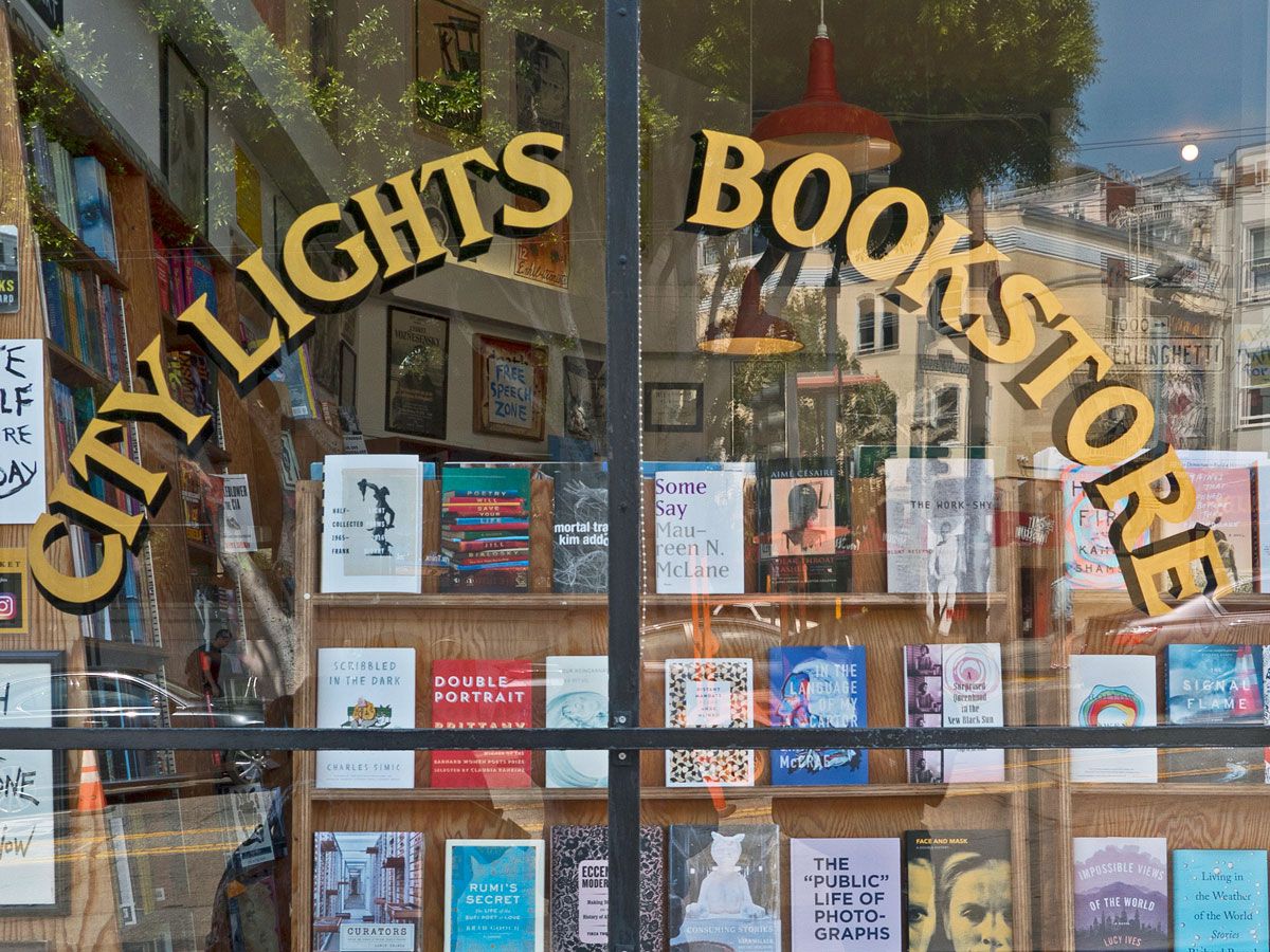 Sign on window for City Lights Bookstore in San Francisco, California