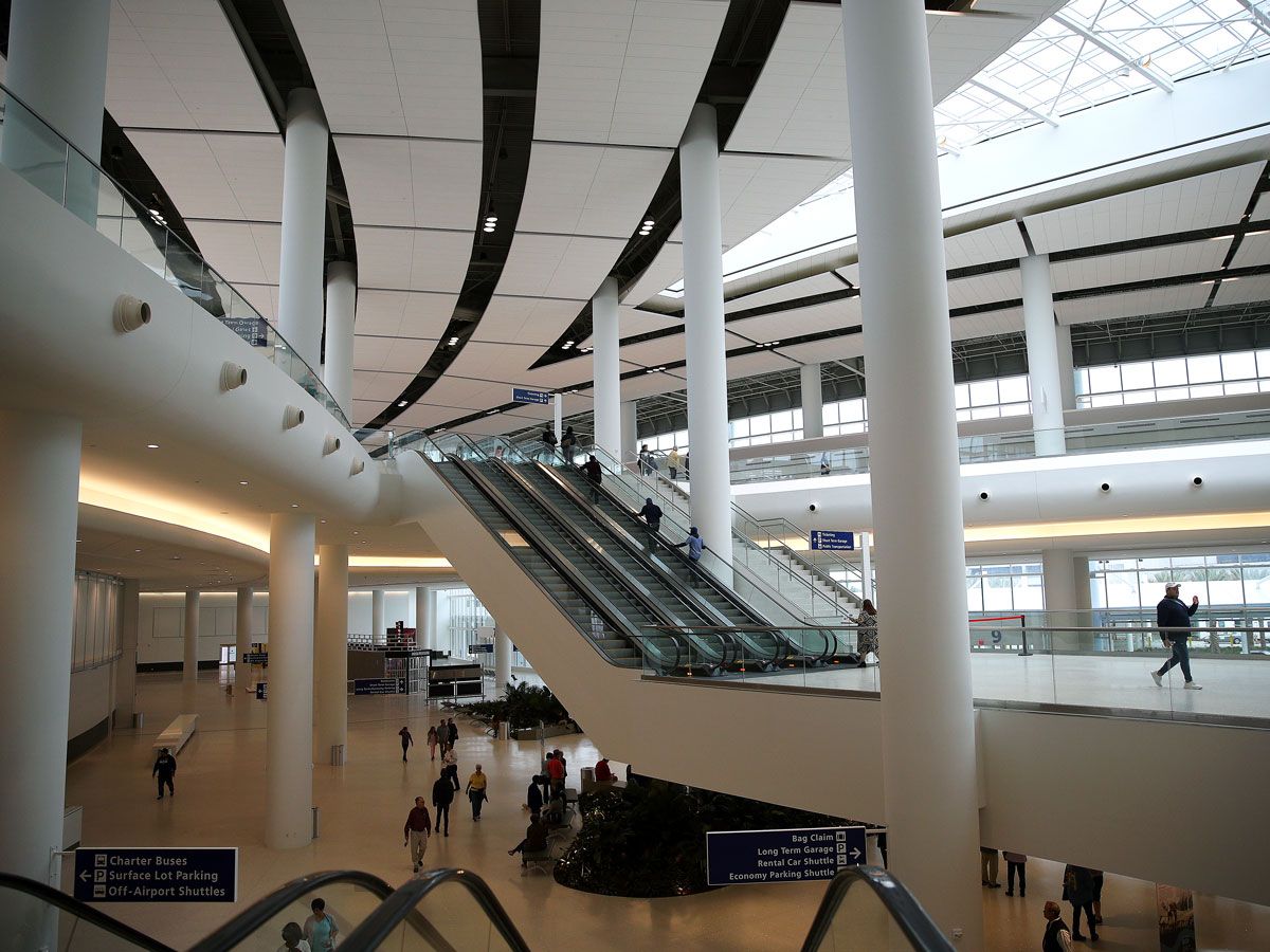 Passengers inside terminal building at Louis Armstrong New Orleans International Airport