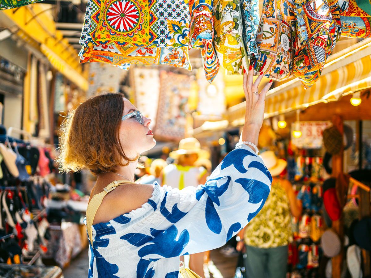Tourist shopping for souvenirs at market