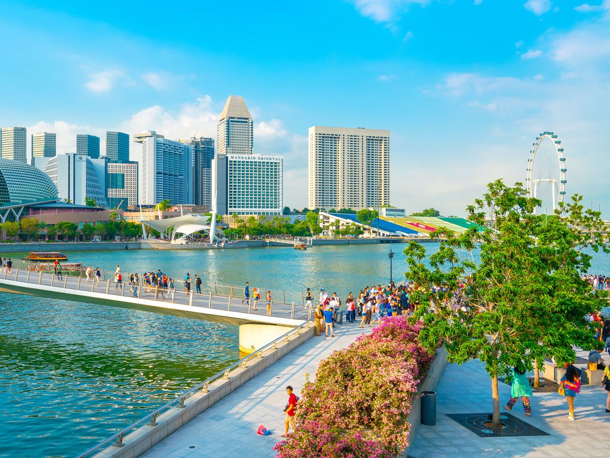 People walking along the Singapore waterfront
