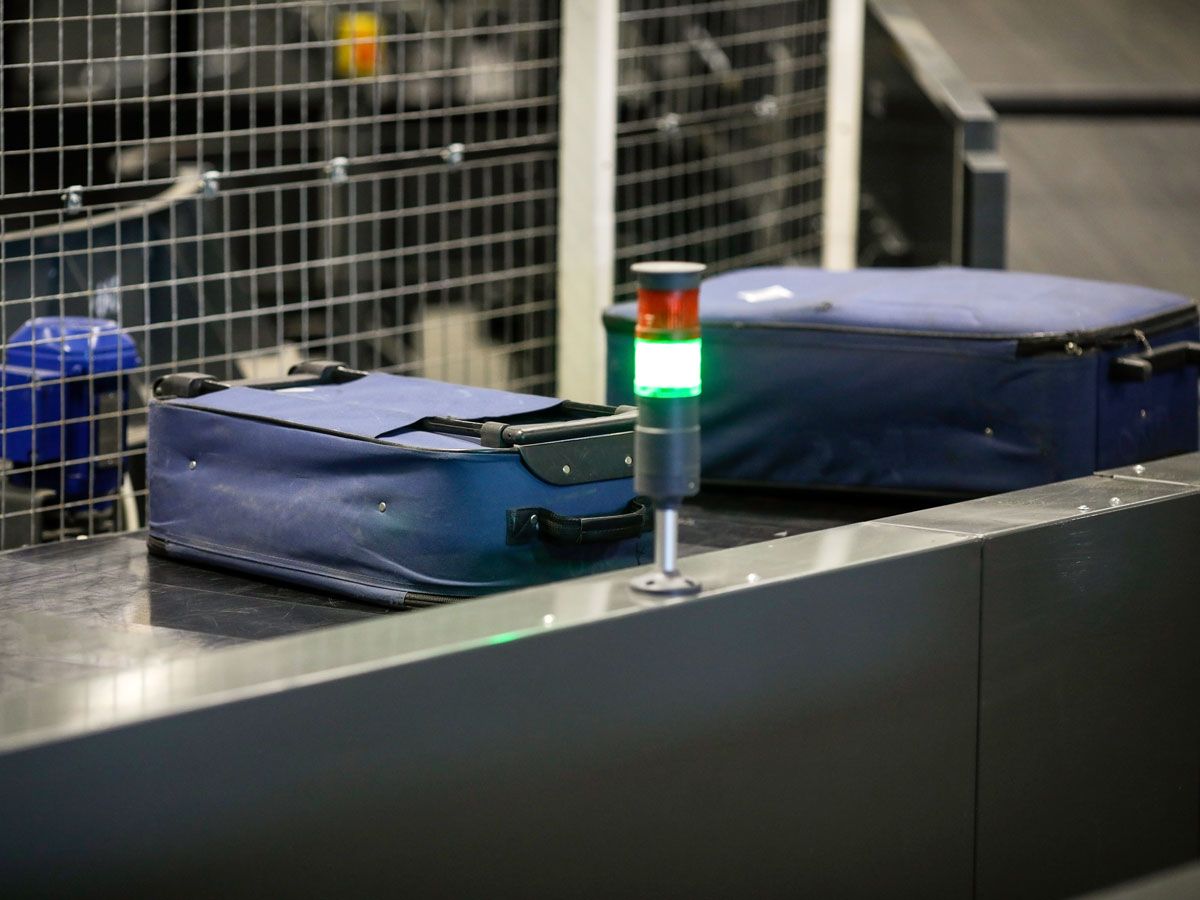 Bags on conveyor belt at airport