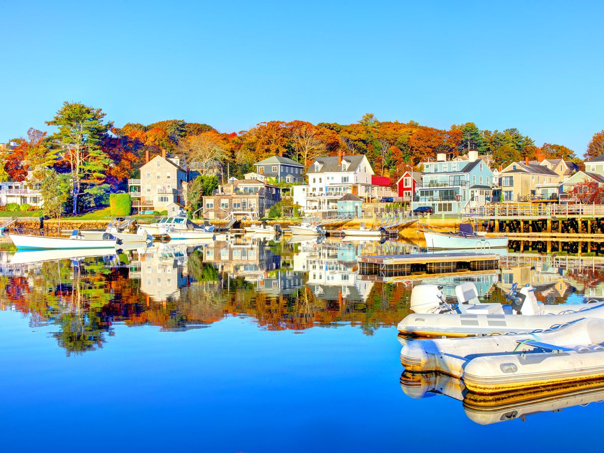 Buildings reflected in water in Manchester-by-the-Sea, Massachusetts