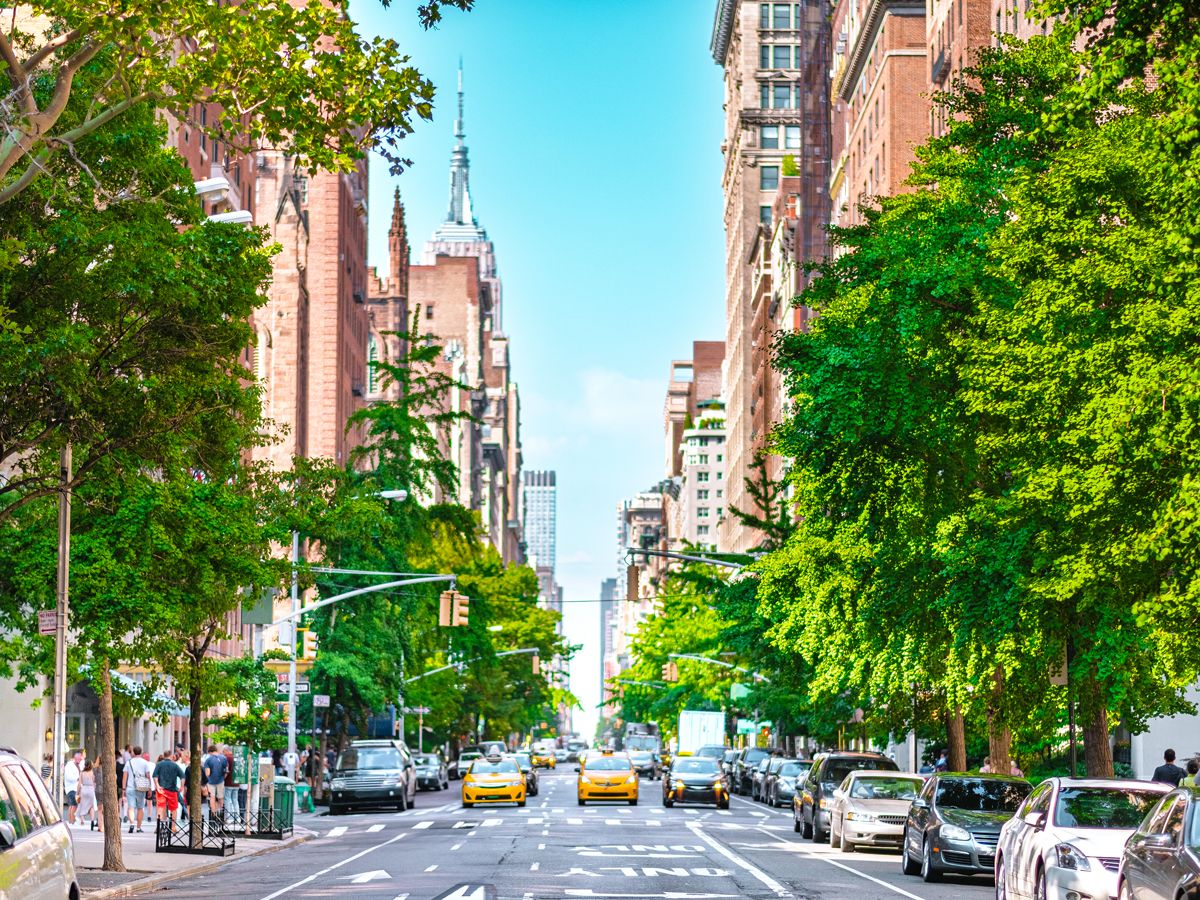 Cars on Manhattan avenue with view of Empire State Building