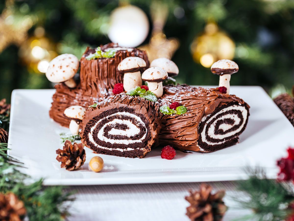 Bûche de Noël on plate with Christmas decor 