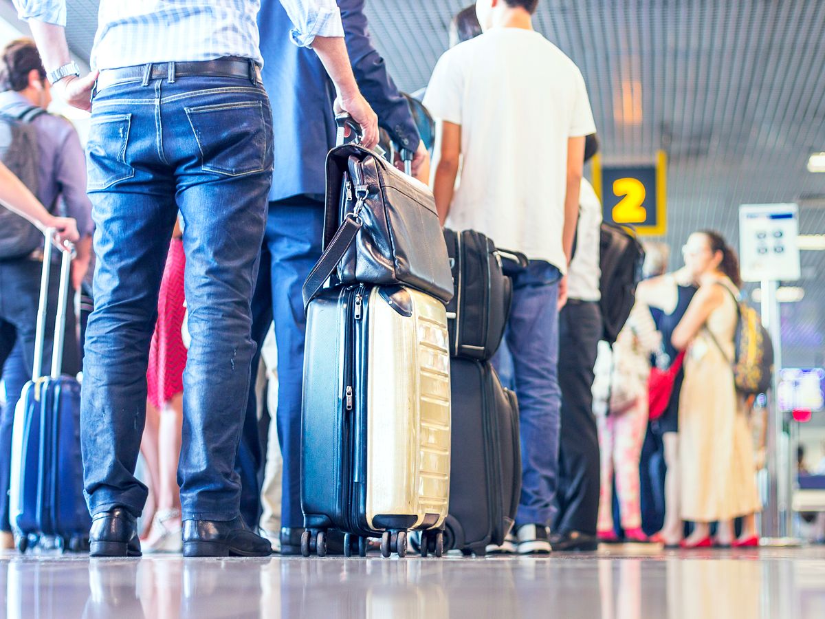 Airline passengers lined up to board at gate