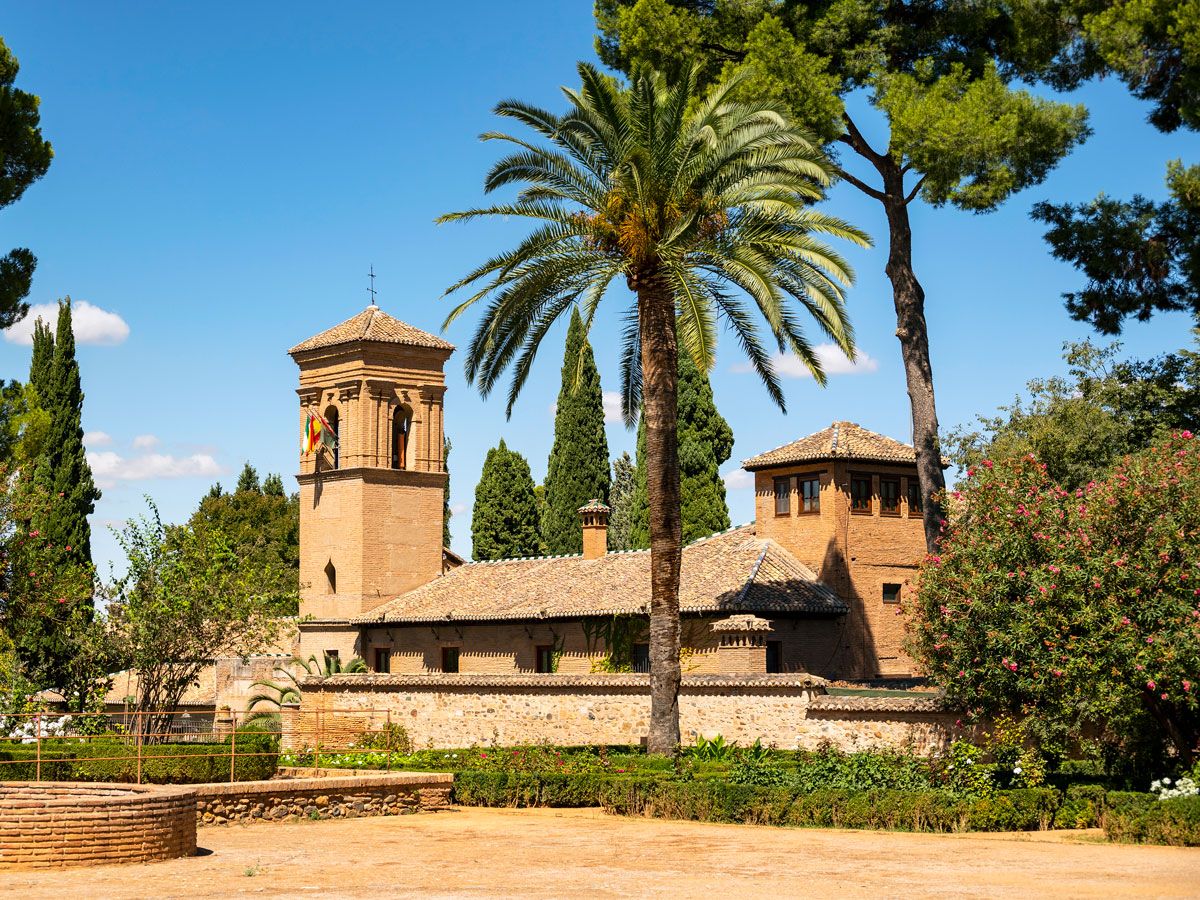 Parador de Granada surrounded by palm trees