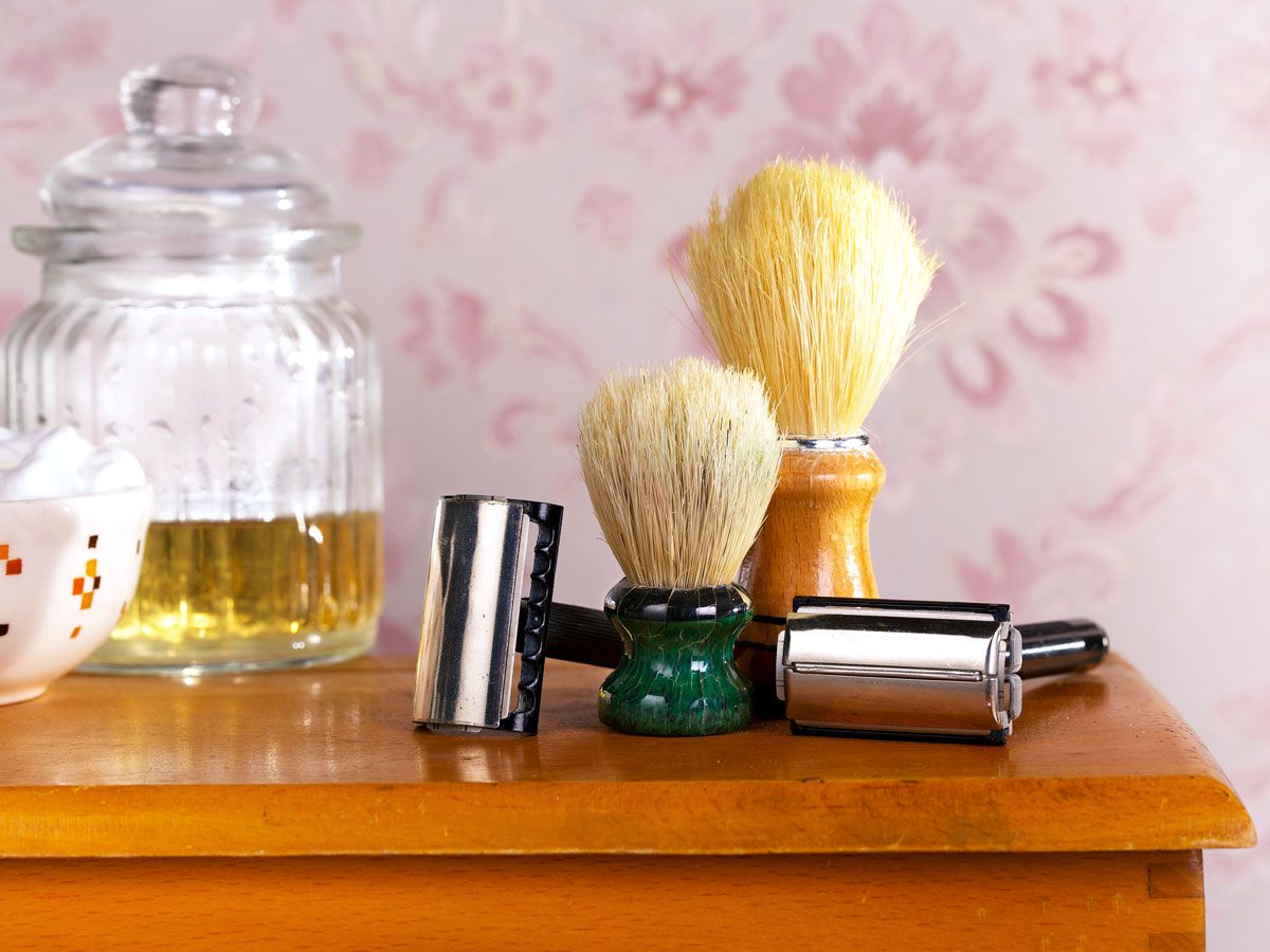 Vintage shaving tools on a wooden table