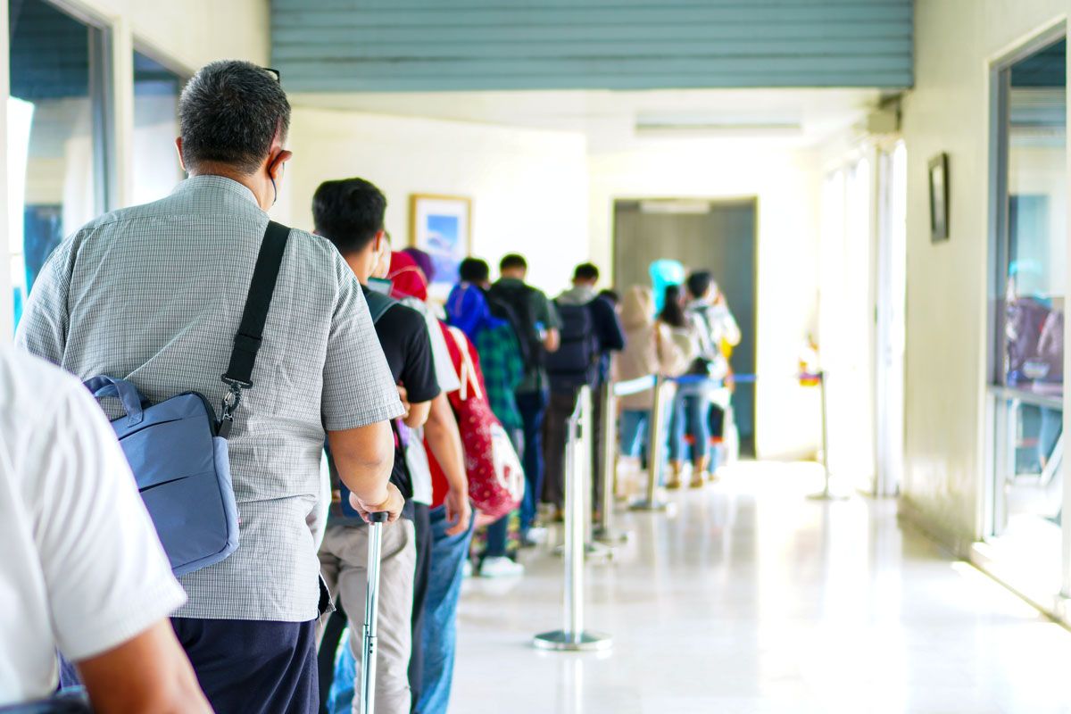 Travelers lined up to board aircraft