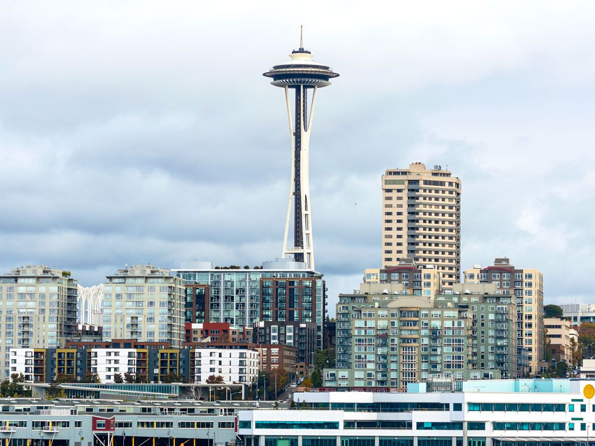 Space Needle and Seattle skyline under cloudy skies