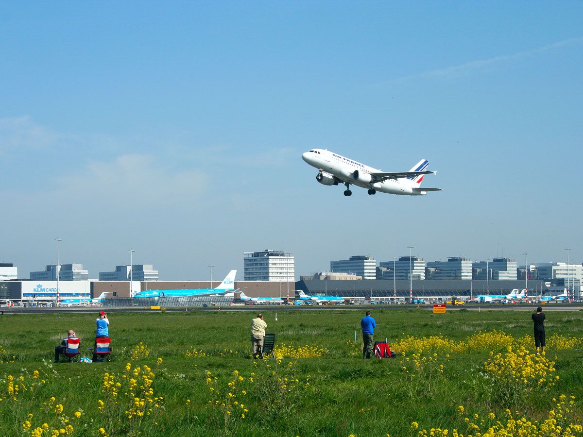 Spotters photographing Air France jet taking off from Amsterdam Schiphol Airport