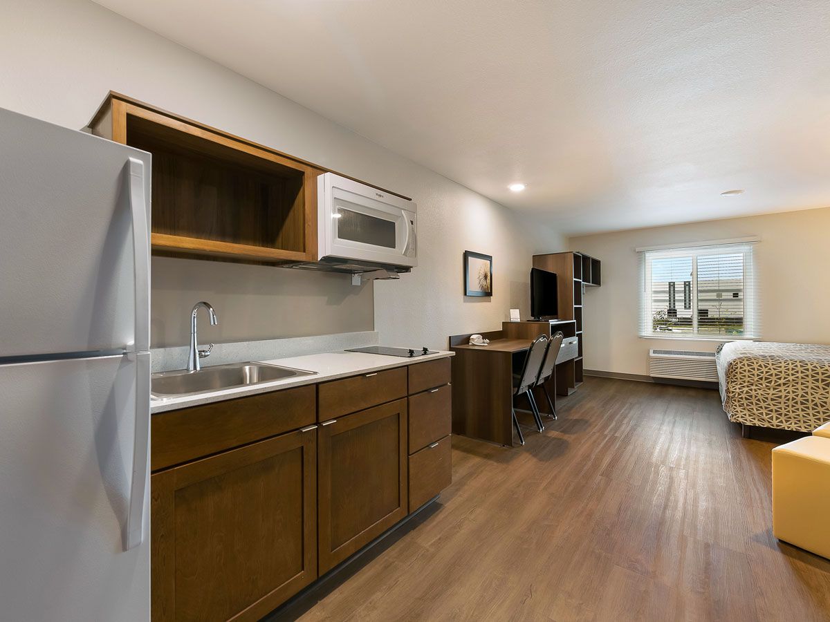 Extended-stay hotel suite with kitchenette
