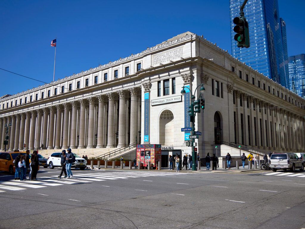 Pedestrians outside the James A. Farley Post Office Building in New York City
